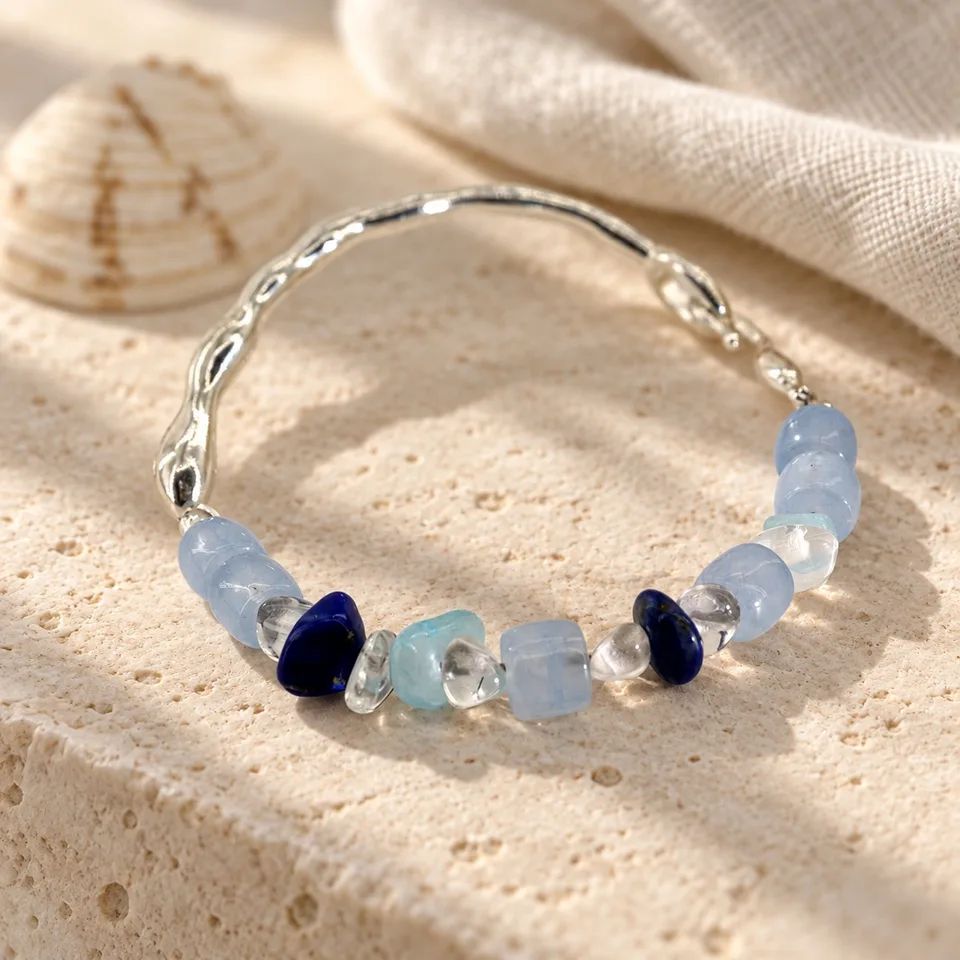 Feltbreath Tideborne bracelet with blue beads and a sculptural silver arc